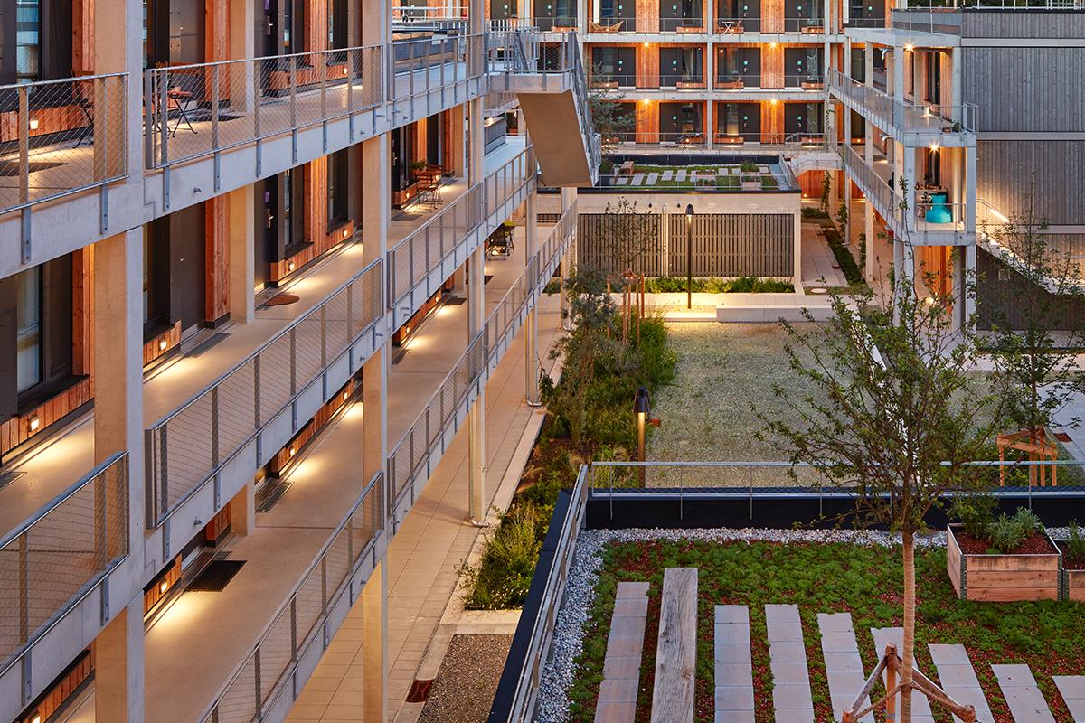 The Campus Ro project in southern Germany was made with prefabricated wooden panels, shortening construction times, and used most materials from a warehouse formerly located on the site, instead of removing the demolition waste and having new resources delivered. Photo PMA Invest.