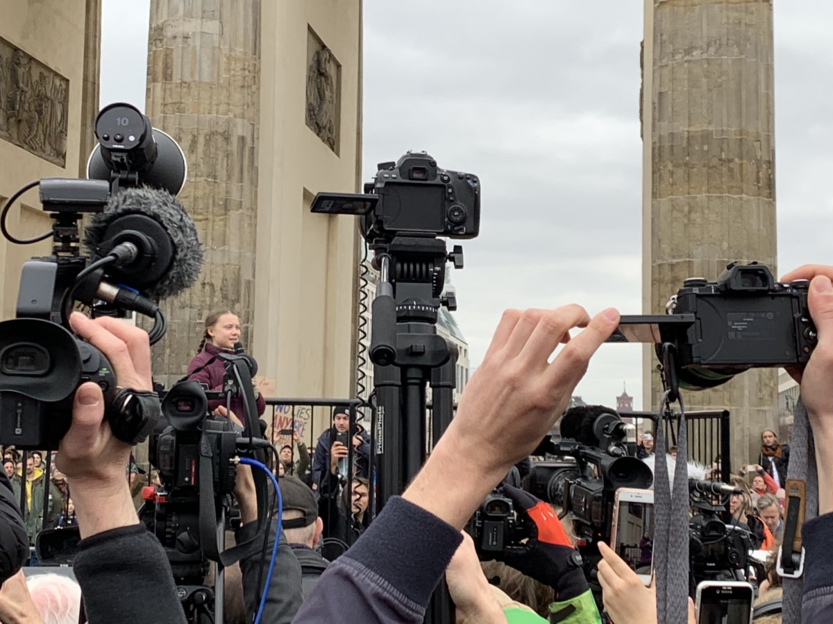 Swedish climate activist Greta Thunberg was met with a swarm of cameras and thousands of supporters when she spoke at Brandenburg Gate in Berlin on March 29, 2019. Photo: Rachel Waldholz