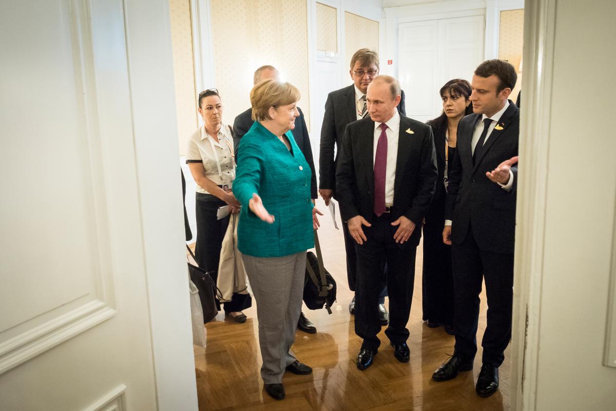 Chancellor Merkel with Russian President Vladimir Putin and French President Emmanuel Macron in Hamburg. Photo: German Government/Kugler