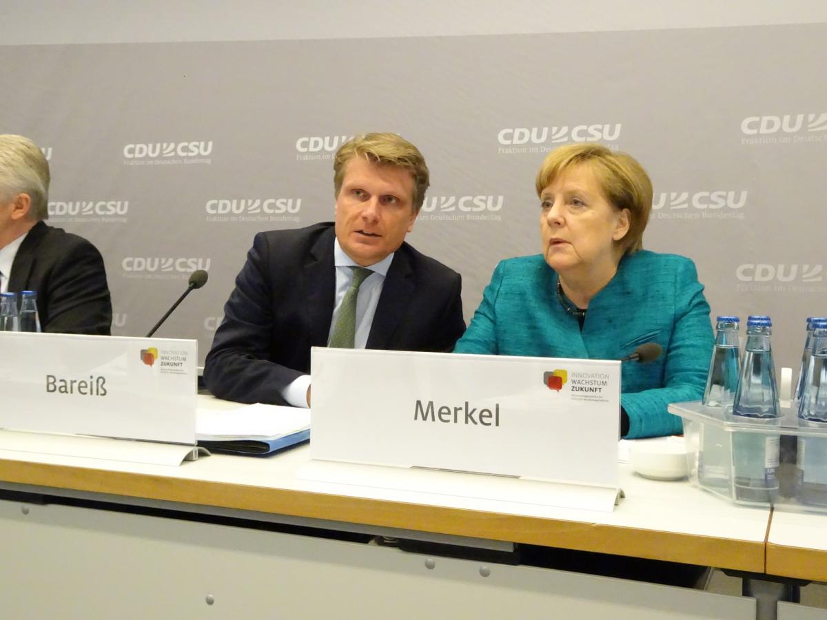 Thomas Bareiß and Angela Merkel at the 8th Energy Policy Dialogue by CDU/CSU Parliamentary Group in the German Bundestag. Source - CLEW 2017.