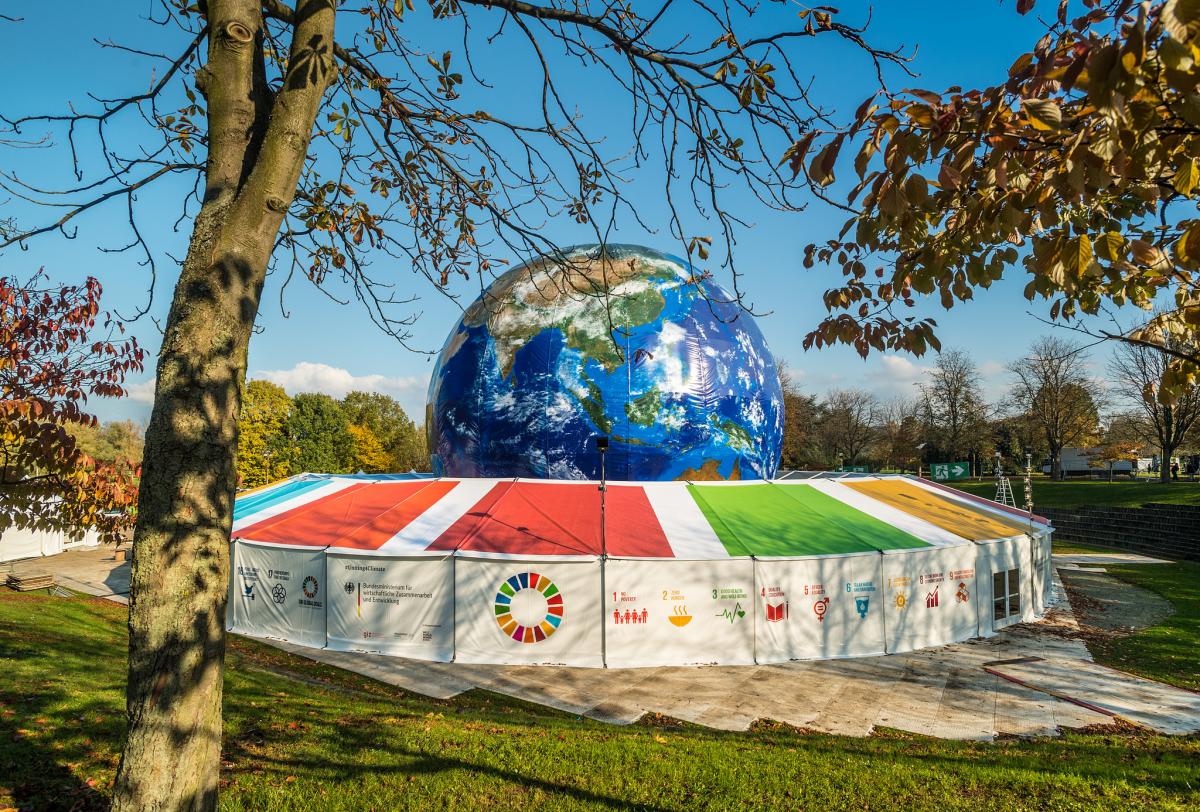 At 24 metres, the German government's Climate Planet is the world's largest model of the earth. Inside, visitors at this year's UN climate conference COP23 in Bonn find out more about the development of the climate and watch a documentary on the evolution of the earth. Photo: © BMUB / Dominik Ketz.