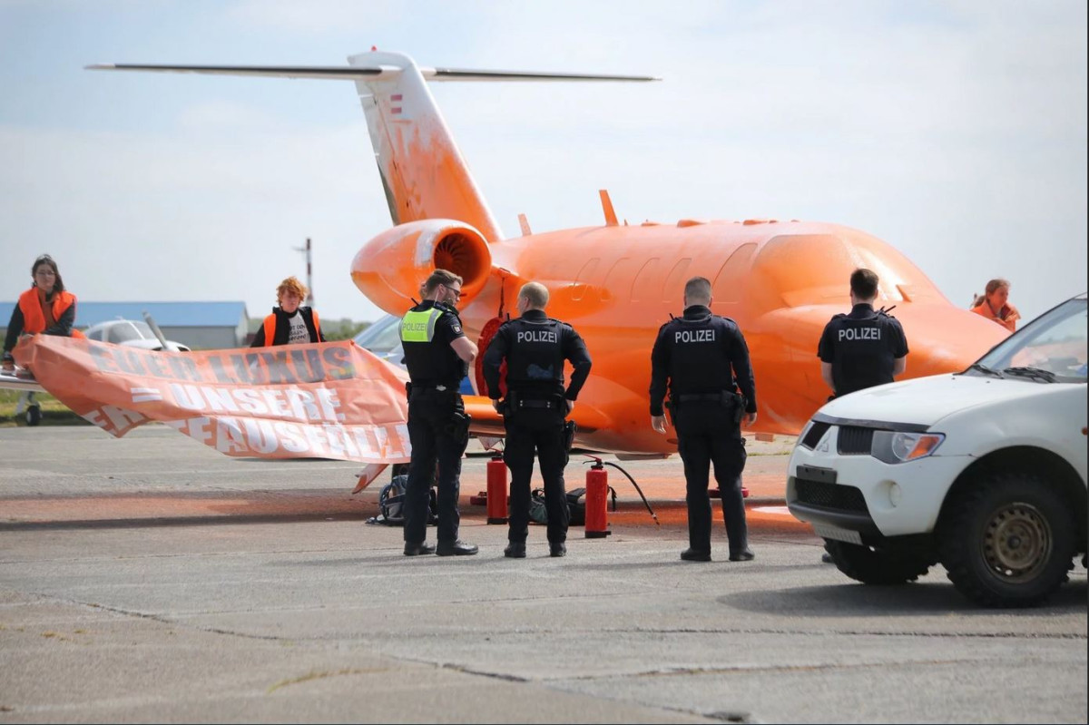 Activists from Germany's "Last Generation" group during an airport attack. Image by Letzte Generation / Jonas Gehring