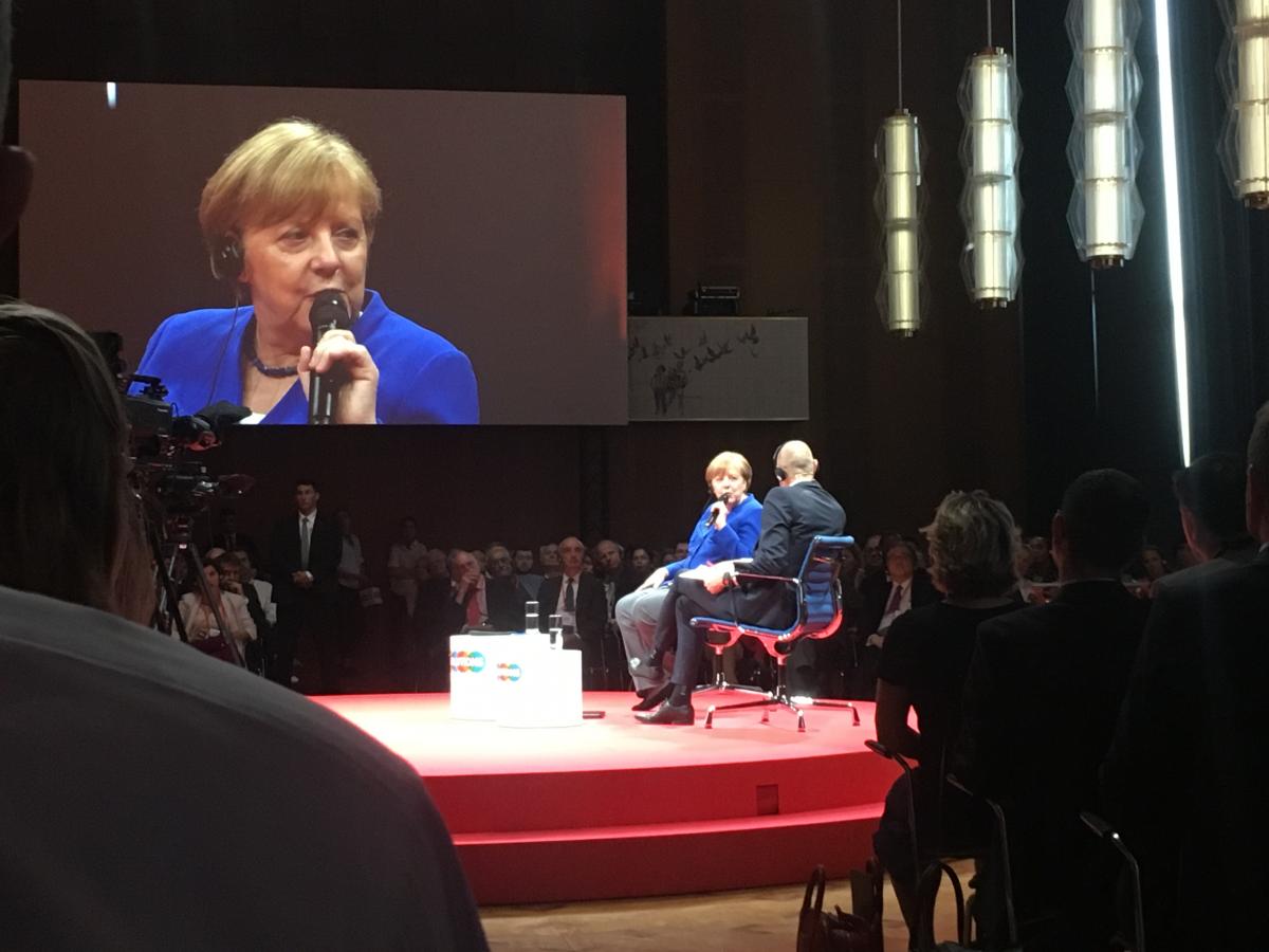 Merkel being interviewed at the Gloabl Solutions Summit in Berlin. Photo:CLEW