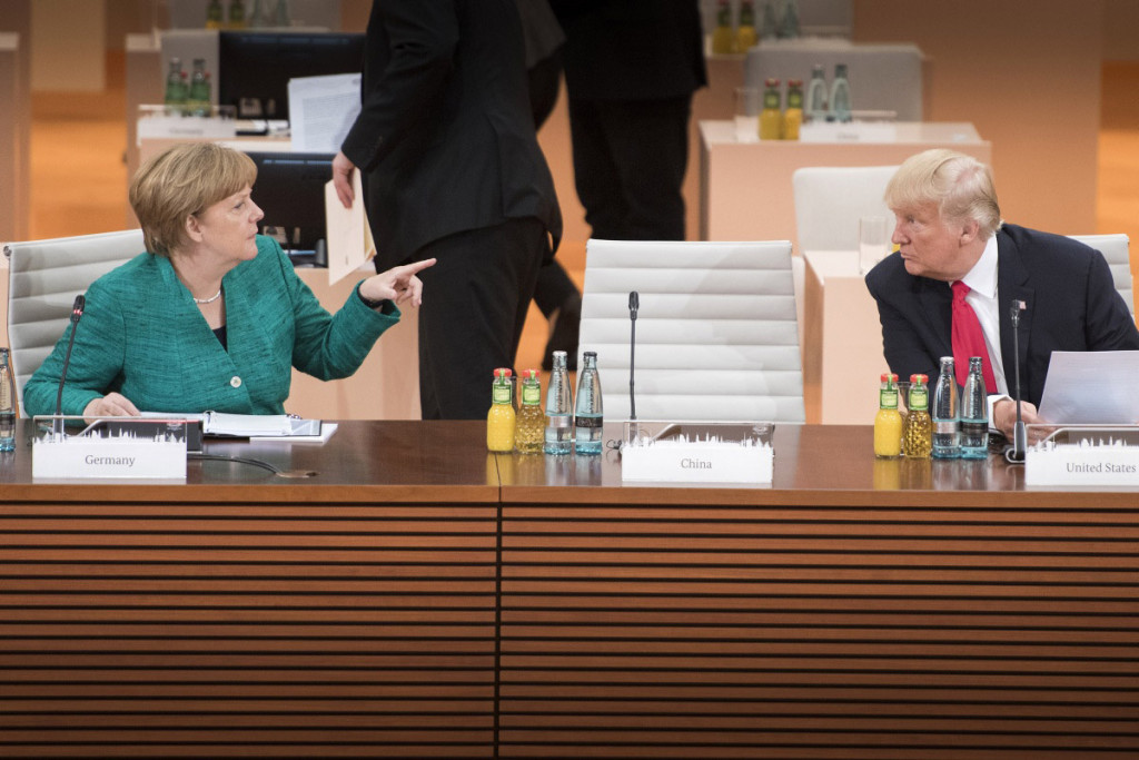 Merkel in conversation with Trump in Hamburg at the G20 summit 2017. Photo: German Government/Bergmann