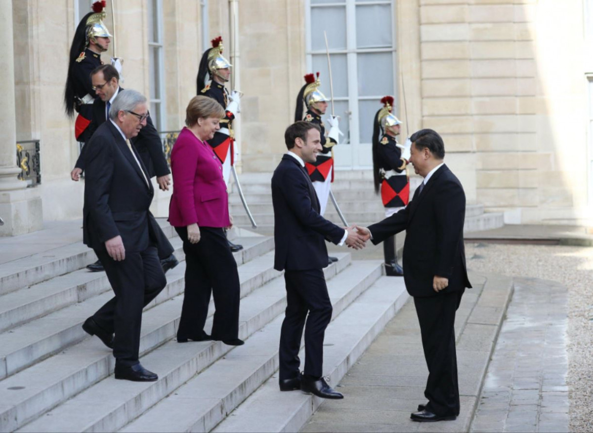 Jean-Claude Juncker, then president of the European Commission, Angela Merkel and Emmanuel Macron meet Xi Jinping at the Paris Peace Forum, 26 March 2019 (Image: Alamy)