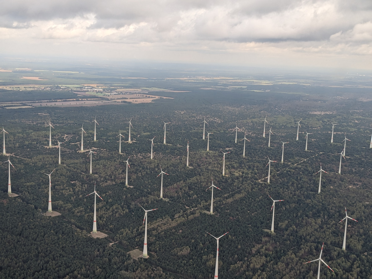 Photo shows aerial view of wind turbines in Brandenburg, Germany. Photo: CLEW/Wettengel.