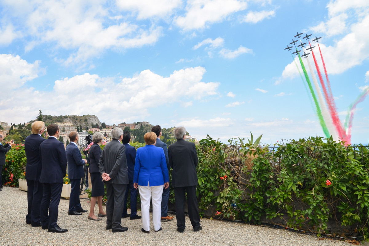 G7 leaders at the 2017 summit in Italy, with planes in background. Photo: Italian G7 Presidency 2017.